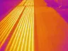 Thermal image of heated pavement: buried heating lines visible from above