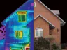 Thermal + visual split view of a brick gable house