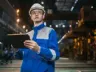 Engineer in Industrial Factory Using Tablet
