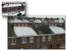 Row houses: snow melted unevenly on roofs (visual)