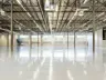 Empty modern warehouse interior with polished concrete floor